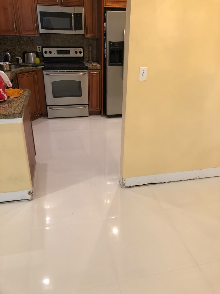 After: kitchen floor demolished and then finished in polished porcelain tile
