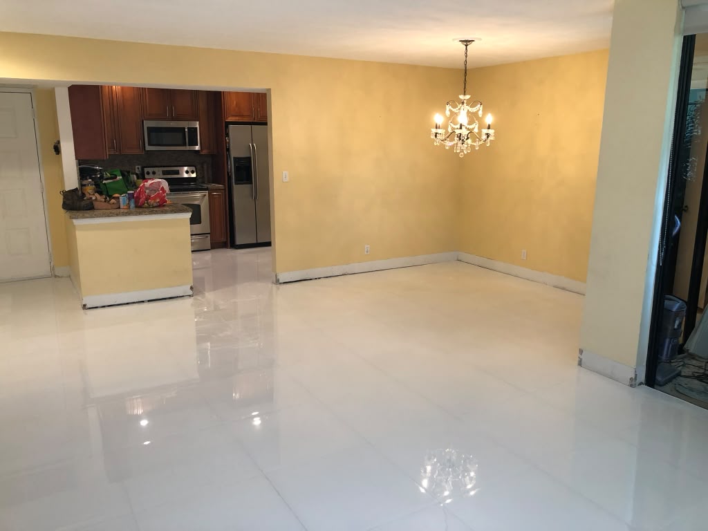 Open living area with new porcelain tile floor